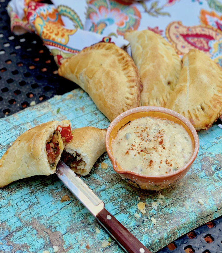 Sausage Peppers and Onion Empanadas with Pale Ale Beer Cheese Sauce