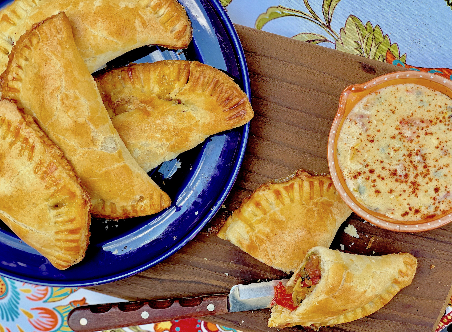 Sausage Peppers and Onion Empanadas with Pale Ale Beer Cheese Sauce